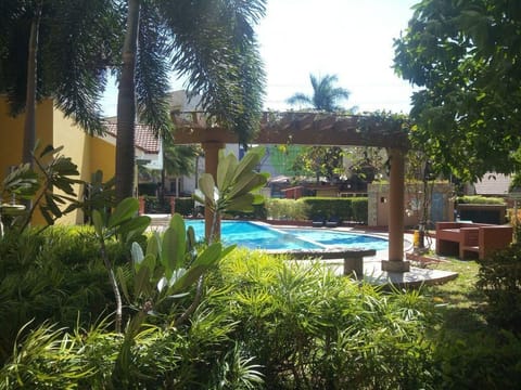 Outdoor pool, open 9:00 AM to 3:00 PM, pool umbrellas