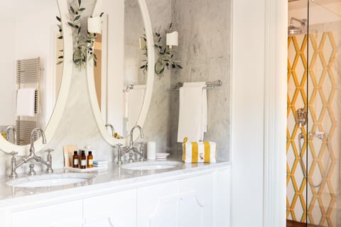 Iconic Suite | Bathroom | Designer toiletries, hair dryer, bathrobes, slippers