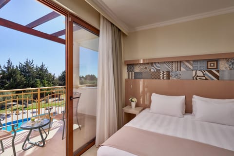 Suite, Garden View | Minibar, in-room safe, individually decorated, individually furnished