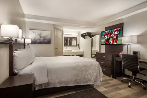Suite, Kitchenette (Smoke Free, 3 Queen Beds) | Desk, blackout drapes, free WiFi, bed sheets