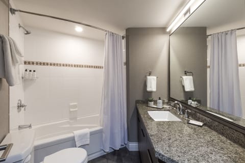 Suite, 2 Bedrooms | Bathroom | Combined shower/tub, deep soaking tub, free toiletries, hair dryer