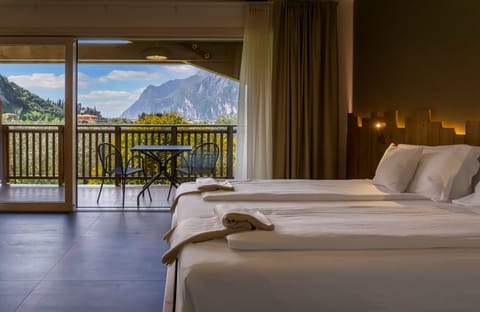 Deluxe Triple Room, Multiple Beds | Premium bedding, down comforters, minibar, in-room safe