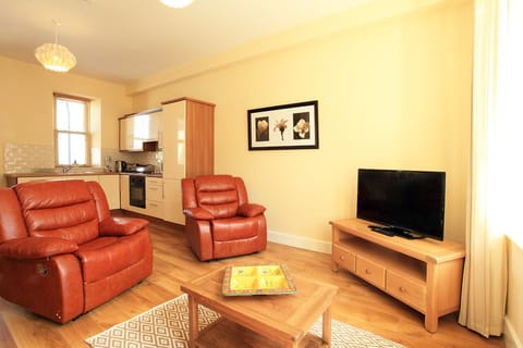 Deluxe Apartment, 2 Bedrooms | Living area | Flat-screen TV