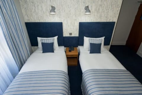 Standard Twin Room | Desk, blackout drapes, iron/ironing board, free WiFi