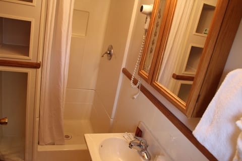 Cuddle Cove #4 (King Bed) | Bathroom | Hair dryer, towels, soap, shampoo