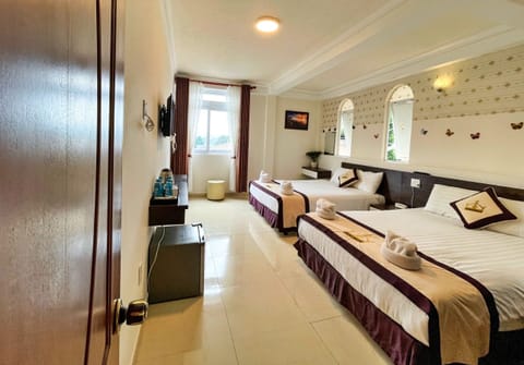 Family Twin Room, 2 Queen Beds, Non Smoking, City View | Minibar, desk, free WiFi