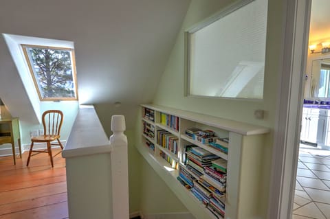 Stairwell from primary bedroom suite to main level