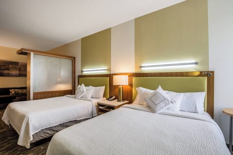 Suite, Multiple Beds | Select Comfort beds, in-room safe, desk, blackout drapes