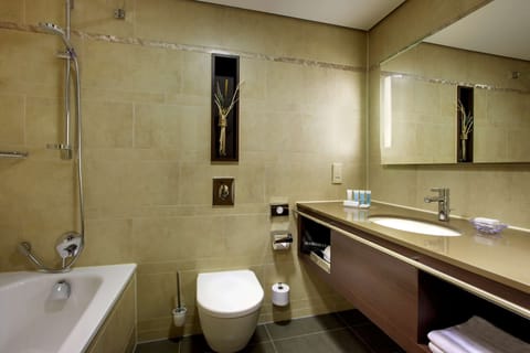 Combined shower/tub, designer toiletries, hair dryer, slippers