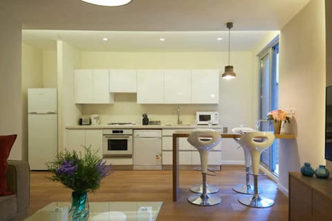 Deluxe Apartment, 2 Bedrooms | Private kitchen | Full-size fridge, microwave, oven, stovetop