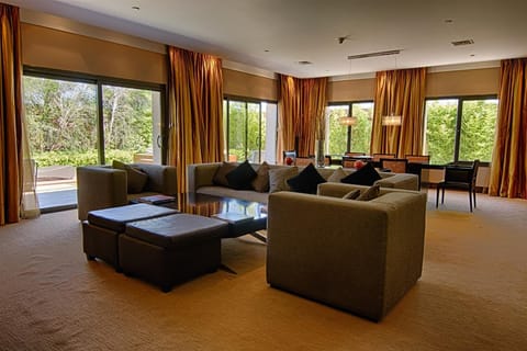 Presidential Studio Suite | Living area | 42-inch LCD TV with cable channels, TV