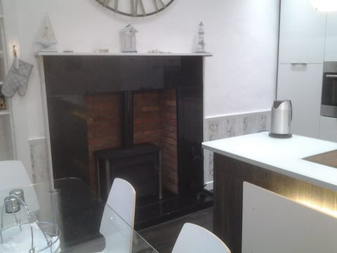 Kitchen (table, island and wood burning stove)