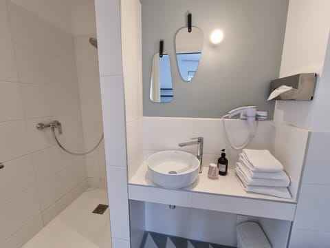 Eco-friendly toiletries, hair dryer, towels, soap