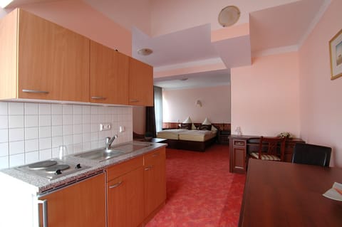 Fridge, microwave, stovetop, coffee/tea maker