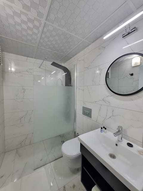 Shower, free toiletries, hair dryer, slippers