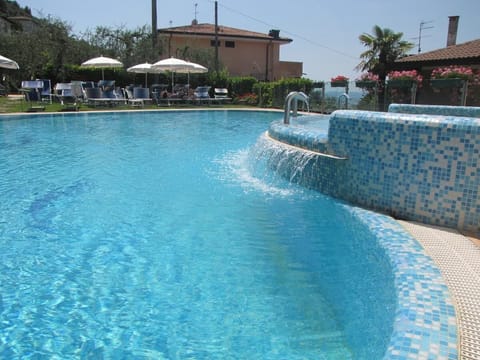 Seasonal outdoor pool, pool umbrellas, sun loungers