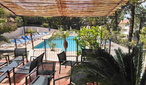 Outdoor pool, pool umbrellas, sun loungers