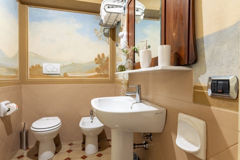 Shower, free toiletries, hair dryer, slippers