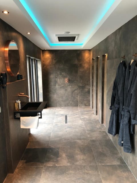 Shower, designer toiletries, hair dryer, bathrobes