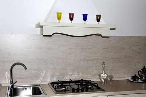 Quadruple Room | Private kitchenette | Fridge, coffee/tea maker, electric kettle