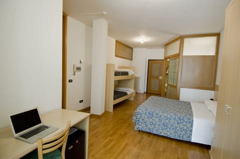 Quadruple Room | Minibar, desk, free WiFi, bed sheets