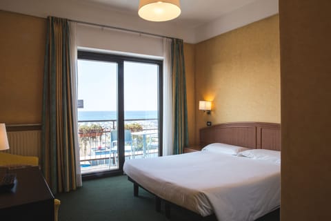 Double Room, Balcony, Sea View | Minibar, in-room safe, desk, cribs/infant beds