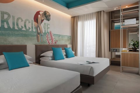 Junior Room, 1 Queen Bed with Sofa bed, Balcony, Beach View | Minibar, in-room safe, individually decorated, desk