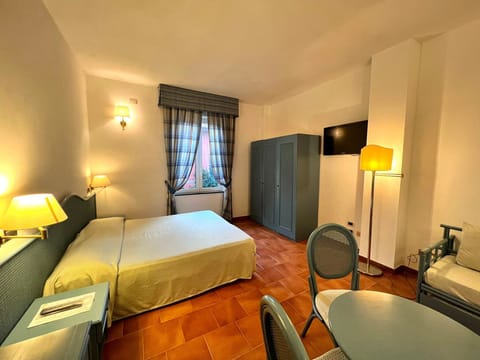 Family Room | Down comforters, minibar, in-room safe, desk