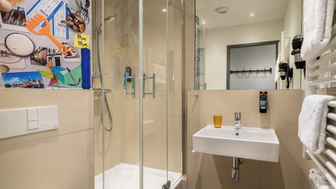 Shower, free toiletries, hair dryer, towels