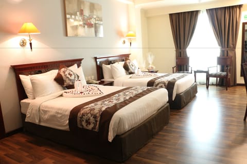 Standard Twin Room | Minibar, in-room safe, iron/ironing board, rollaway beds