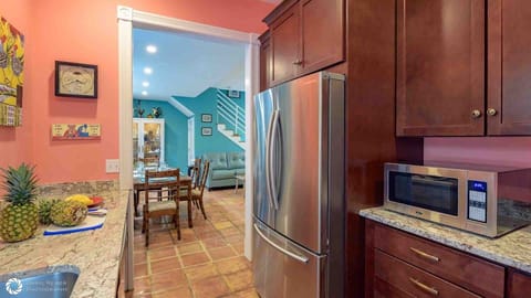 The fully equipped kitchen is next to the living room...