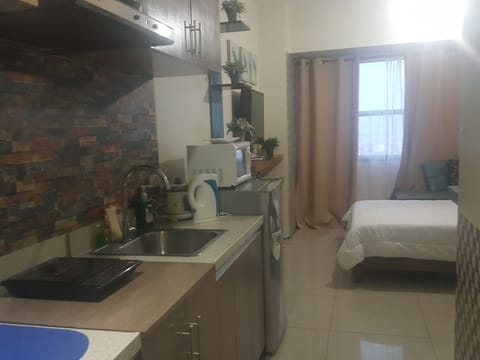 Condo Studio | Private kitchen | Full-size fridge, microwave, stovetop, coffee/tea maker