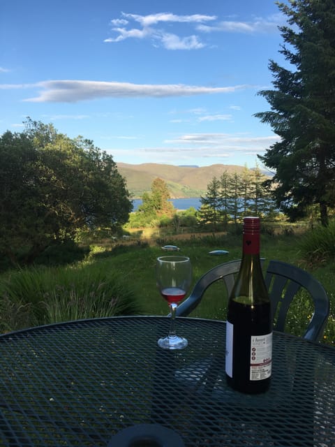 Enjoy a glass of something outside the house with stunning views off Loch Broom
