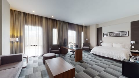 Suite, 1 King Bed, Refrigerator | Premium bedding, minibar, in-room safe, desk