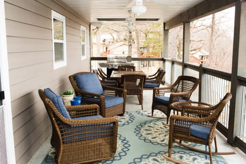 large covered balcony on the back of the house