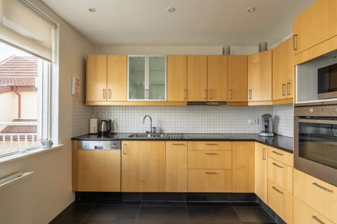 Superior Apartment, 2 Bedrooms | Private kitchen | Fridge, microwave, oven, coffee/tea maker