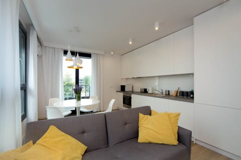 Deluxe Apartment, 1 Queen Bed with Sofa bed (Pure White) | Living area | Flat-screen TV, iPod dock, MP3 dock