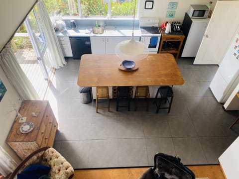View down to kitchen from mezzanine bedroom. August 2021.