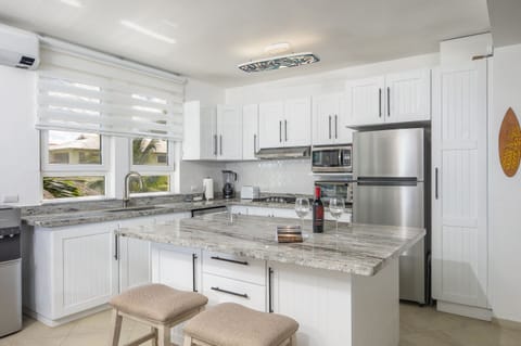 Kitchen is Modern & Remodeled. A Large Granite Island is great for eating & prep