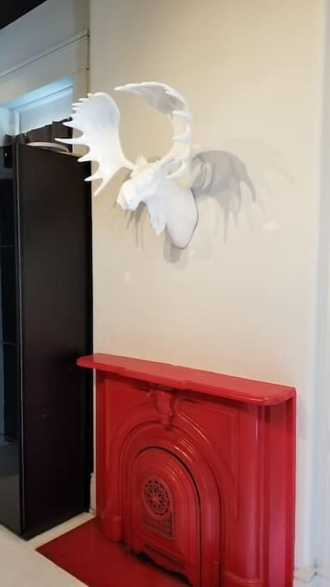 Master Bedroom with Fireplace, Dresser and Chuck the Moose