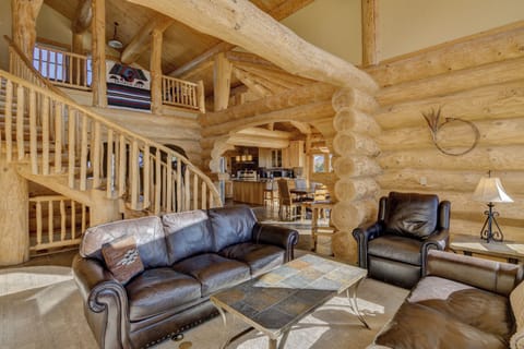 Great Room looking to kitchen and dining room. Stairs lead to master and loft.