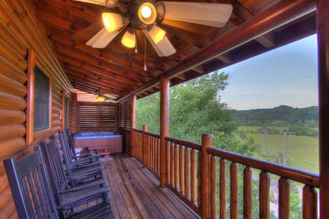 Main Deck with hot tub, plenty of rocking chairs, and fabulous mountain views