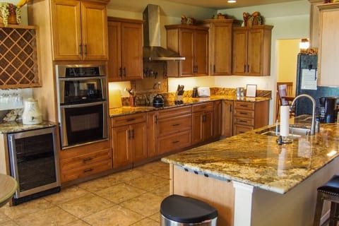 Kitchen w/ wine fridge, microwave, and oven