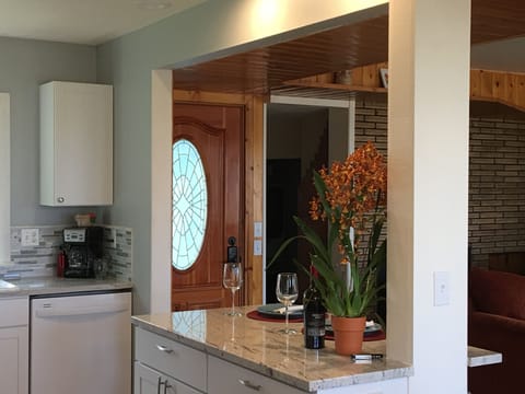 Looking at entry door from kitchen/dining area