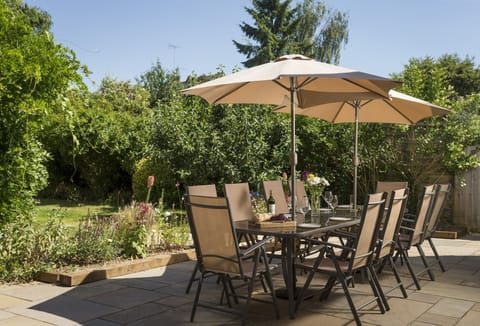 Garden Enclosed garden with table seating twelve guests and barbecue