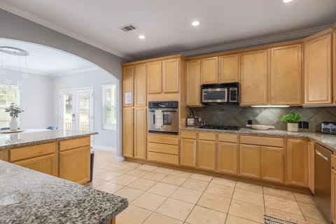 Prepare your favorite meal in the well-stocked kitchen which has stainless steel appliances and ample counter space