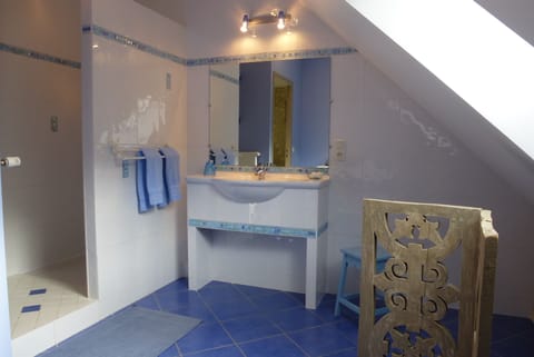 Family Triple Room (Blue) | Bathroom | Hair dryer, towels