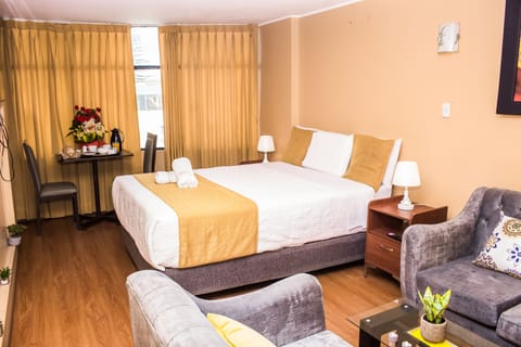 Premium Room | Premium bedding, down comforters, laptop workspace, blackout drapes