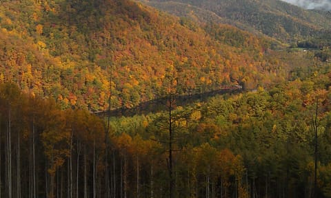 view of the lake from the mountains surrounding it