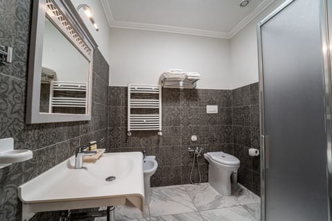 Economy Double Room, No Windows | Bathroom | Shower, rainfall showerhead, free toiletries, hair dryer